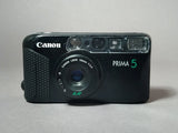 CANON PRIMA 5  Fotocamera compatte Analogiche 35mm. a Pellicola AUTOFOCUS MOTORE - FLASH INTEGRATO ANTI OCCHI ROSSI